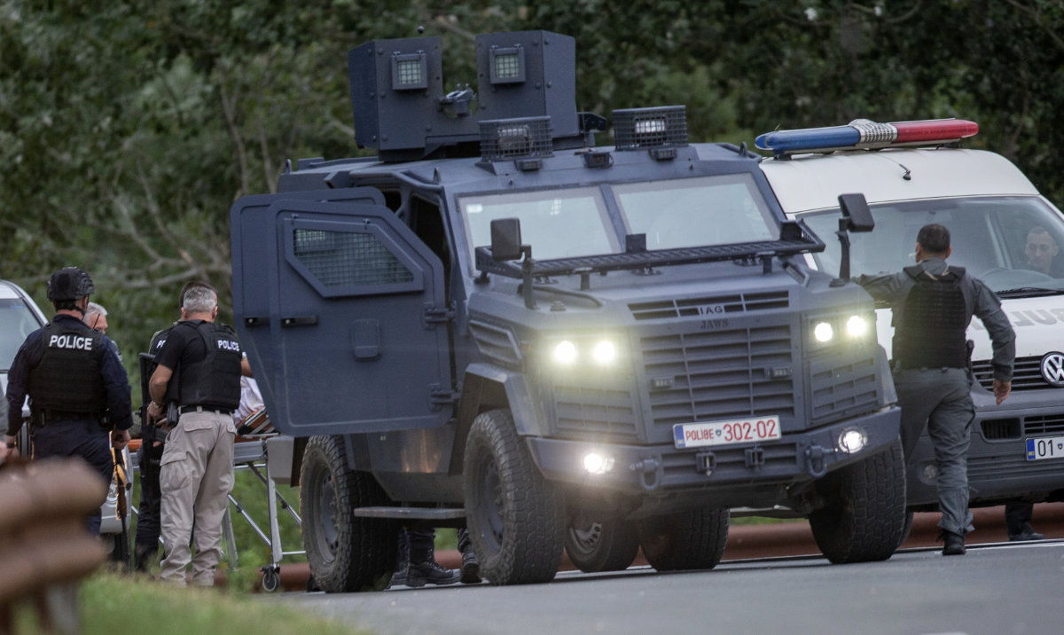 Kosovo police officers evacuate a wounded person at a cross road leading to the Banjska Monastery in the village of Banjska on Sunday, Sept. 24, 2023. (AP)