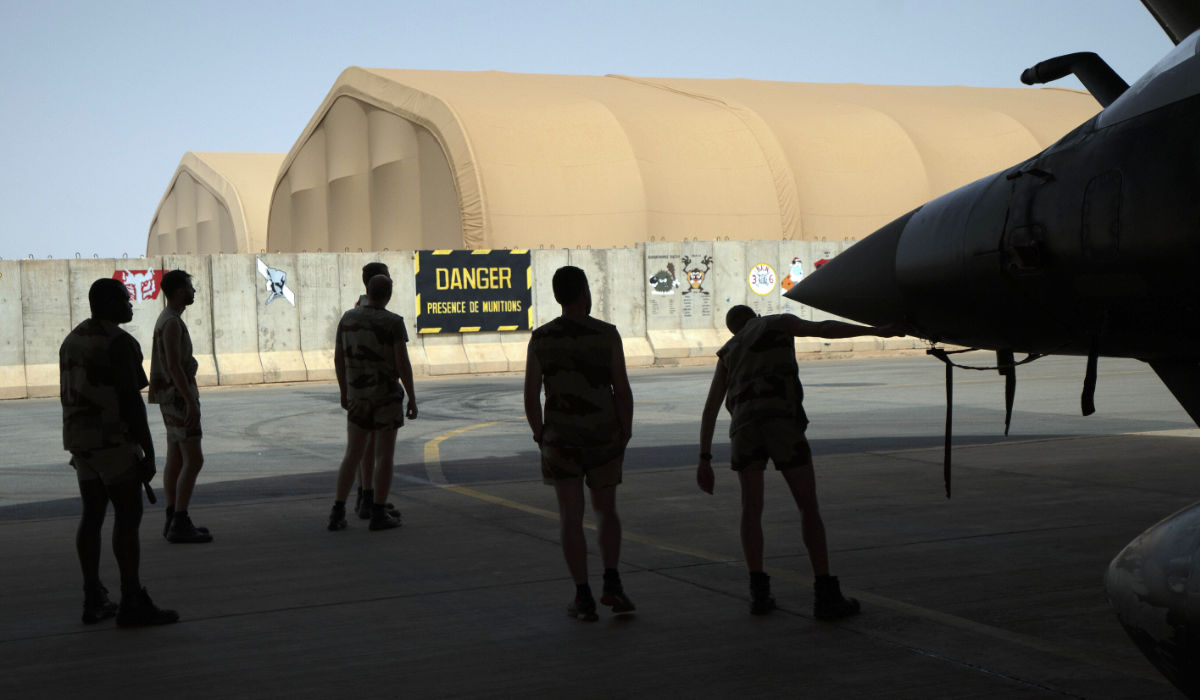 French Barkhane Air Force mechanics maintain a Mirage 2000 on the Niamey, Niger base on June 5, 2021. (AP)