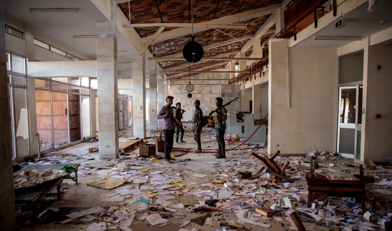 Amhara Fano militia fighters walk in the ransacked terminal at the Lalibela airport in Lalibela, on December 7, 2021. (AFP/File)