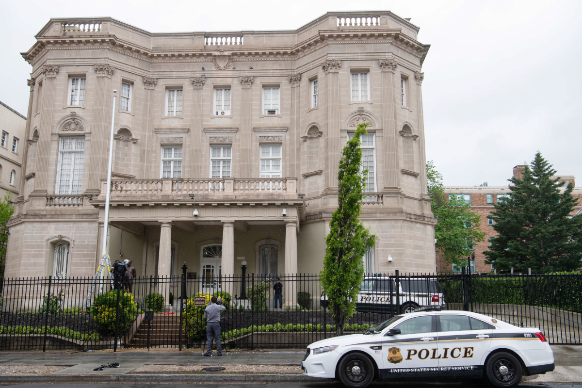 Members of the US Secret Service conduct an investigation at the Cuban embassy in Washington, DC, on April 30, 2020 after a man fired at the building. (AFP)