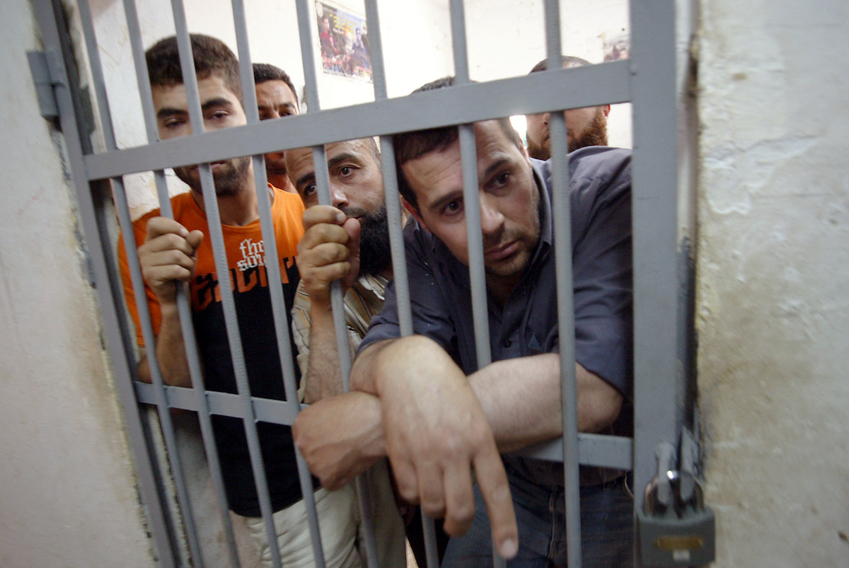 Arrested members of the Hamas movement are seen in their cell at a Palestinian Authority prison, in Jenin. (File/AFP)