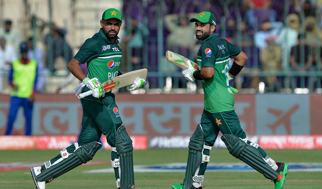 Pakistan's captain Babar Azam (L) and Mohammad Rizwan run between the wickets during the Asia Cup 2023 cricket match between Pakistan and Nepal at the Multan Cricket Stadium in Multan on August 30, 2023. (AFP/File)