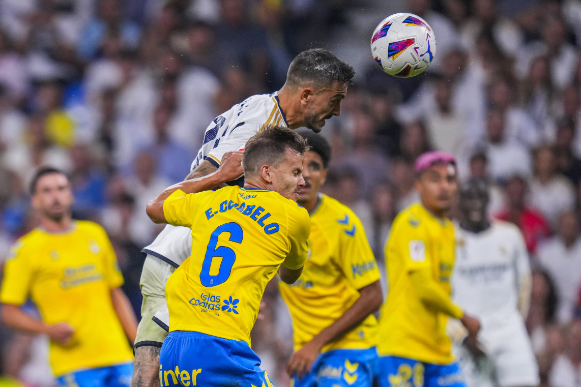 Real Madrid's Joselu, top, heads the ball to score his side's second goal during a Spanish La Liga soccer match against Las Palmas, at Santiago Bernabeu stadium, in Madrid, Wednesday. (AP)