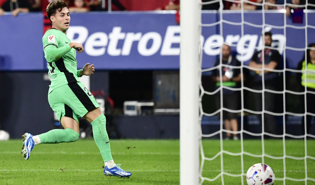 Atletico Madrid's Spanish midfielder Rodrigo Riquelme scores his team's second goal during the Spanish Liga football match between CA Osasuna and Club Atletico de Madrid at El Sadar stadium on Thursday. (AFP)