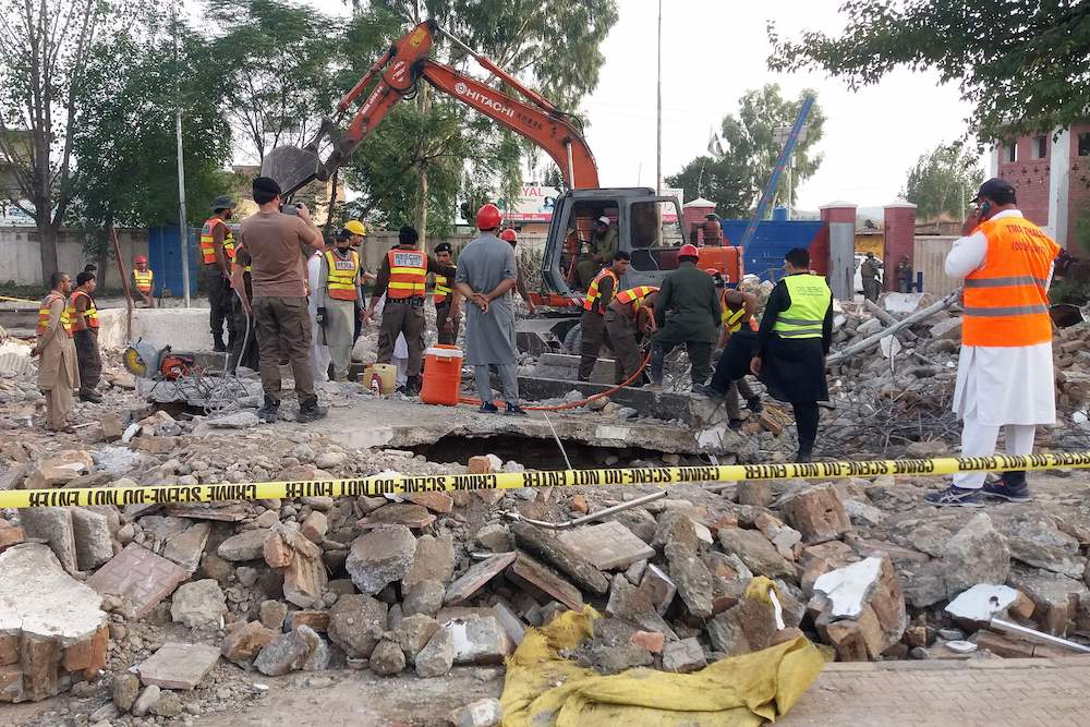 Rescue workers search for blast victims in the debris of a collapsed mosque following a suicide attack in Hangu on Sept. 29, 2023. (AFP)