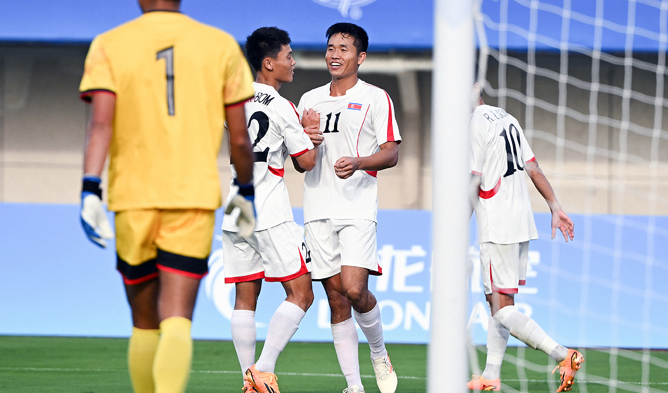 North Korea’s Kim Kuk Jin (C) celebrates his goal during the football match between North Korea and Taiwan during the Hangzhou 2022 Asian Games in Jinhua, China's eastern Zhejiang province on September 19, 2023. (AFP)