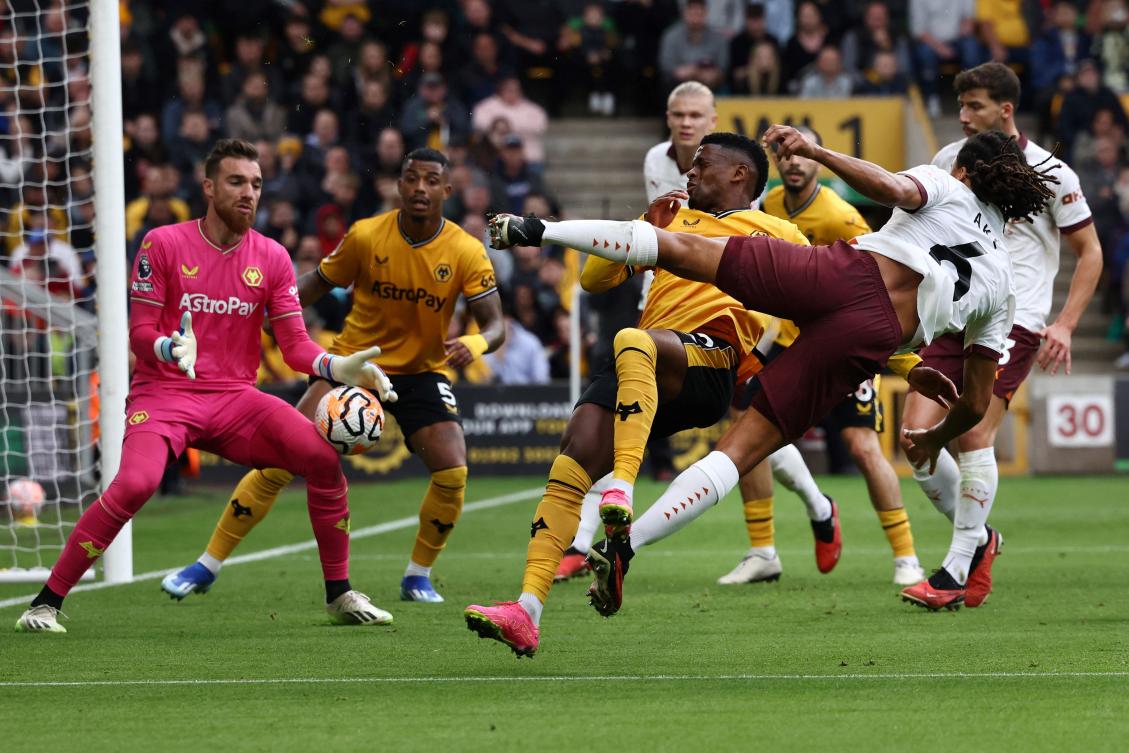 Manchester City’s Dutch defender Nathan Ake shoots the ball but it’s stopped by Wolverhampton Wanderers’ Portuguese goalkeeper Jose Sa during their Premier League match at the Molineux stadium in Wolverhampton on Sept. 30, 2023. (AFP)