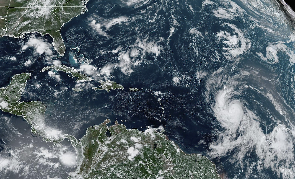 A satellite image shows Hurricane Lee, right, off in the central tropical Atlantic Ocean. (AP)