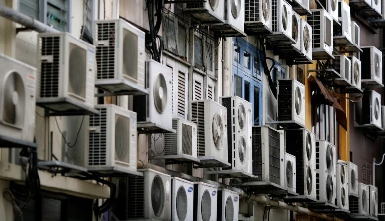 Air conditioning units on an exterior wall of a building in Singapore’s financial district, Dec. 11, 2009. (Reuters)