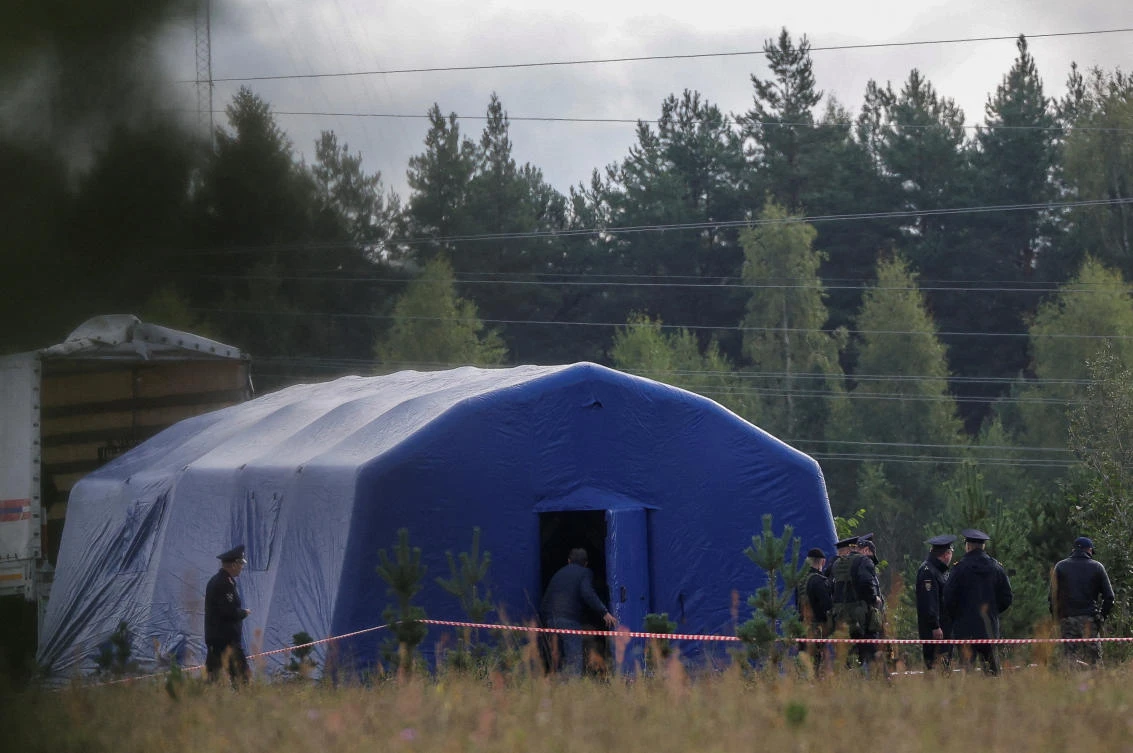 Police officers keep guard at a checkpoint near the site of the crash of a private jet linked to Wagner mercenary chief Yevgeny Prigozhin in the Tver region, Russia, on Aug. 24, 2023. (Reuters)