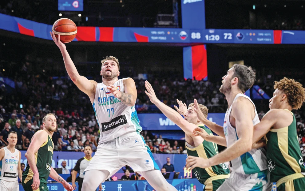 Slovenia’s Luka Doncic, center, drives to the basket during the FIBA Basketball World Cup Group K match between Slovenia and Australia at Okinawa Arena in Okinawa on Friday. (AFP)