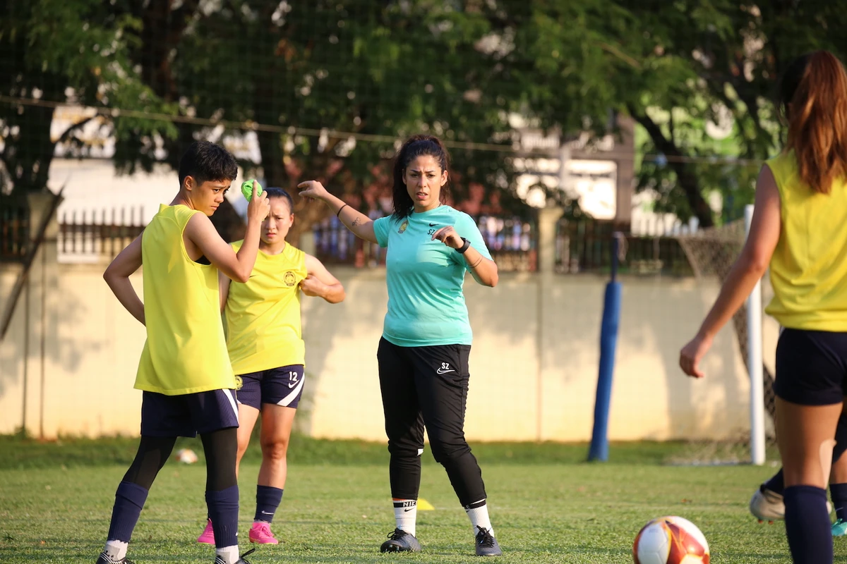 Head coach of the Malaysian women’s national team, Soleen Al-Zoubi, interacts with her players during a training session for SEA Games in Phnom Penh, Cambodia. (Football Association of Malaysia)