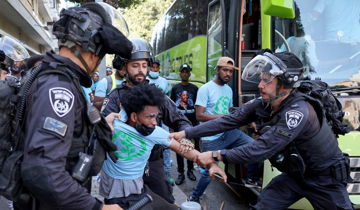 Members of Israel's security forces clash with Eritrean asylum-seekers protesting an event organised by Eritrea's government in the coastal city of Tel Aviv on September 2, 2023. (AFP)