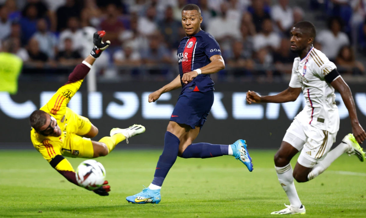 Paris St Germain's Kylian Mbappe scores their fourth goal during the French league match against Lyon at Groupama Stadium on Sunday. (Reuters)