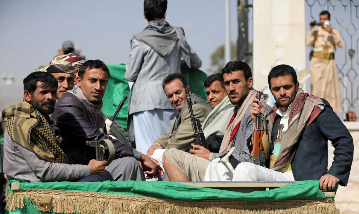 Armed Houthi followers ride on the back of a truck in Sanaa, Yemen. (Reuters/File)