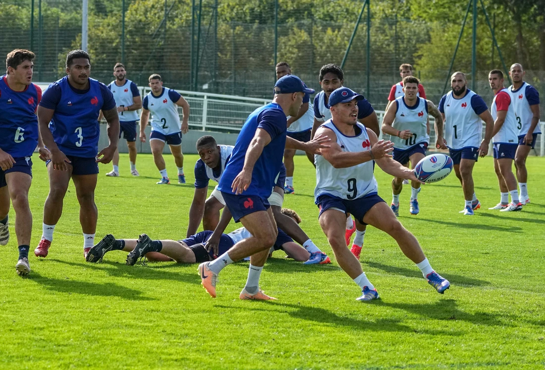 France's Maxime Lucu, left, and Antoine Dupont train with their teammates during a training session at their base camp's training center in Rueil-Malmaison, outside Paris. (AP)