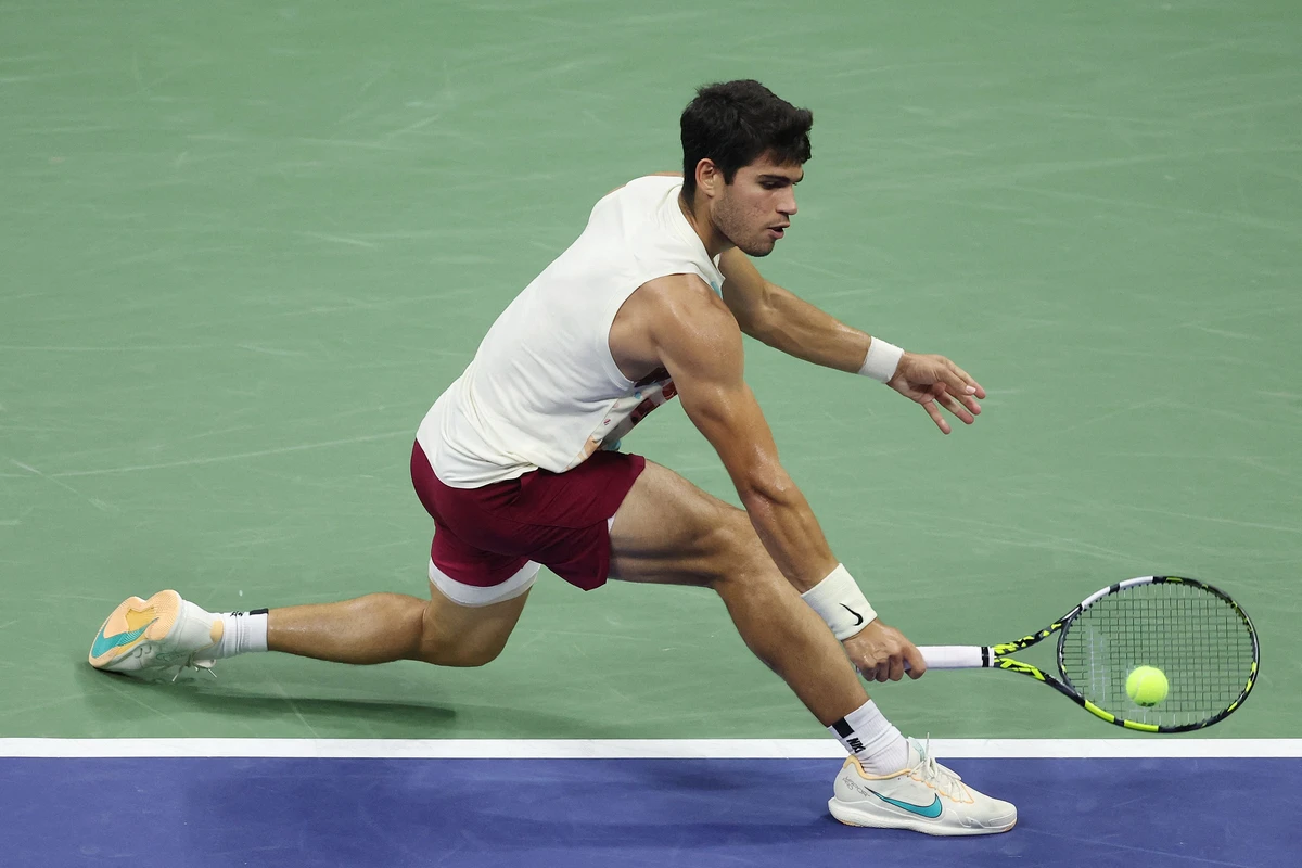 Carlos Alcaraz of Spain returns a shot against Alexander Zverev of Germany during their men's singles quarterfinal at the 2023 US Open at the USTA Billie Jean King National Tennis Center on Wednesday in New York City. (AFP)