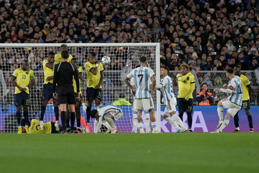 Argentina's forward Lionel Messi (R) scores free kick goal against Ecuador's goalkeeper Hernan Galindez during the 2026 FIFA World Cup South American qualifiers match between Argentina and Ecuador. (AFP)