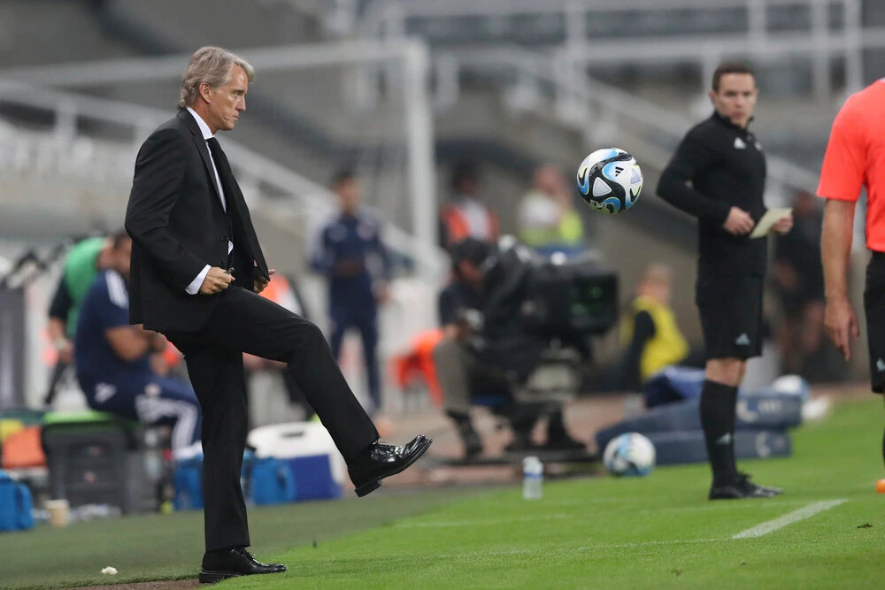 Saudi Arabia manager Roberto Mancini plays the ball on the sideline during an international friendly soccer match between Costa Rica and Saudi Arabia at St. James’ Park, on Sept. 8, 2023, in Newcastle. (AP)