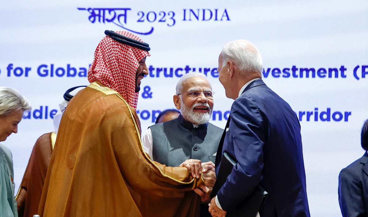 Saudi Arabia Crown Prince Mohammed bin Salman and US President Joe Biden shake hands next to Indian Prime Minister Narendra Modi on the day of the G20 summit in New Delhi on September 9, 2023. (REUTERS)