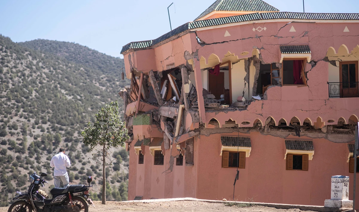 A man stands next to a damaged hotel after the earthquake in Moulay Brahim village, near the epicentre of the earthquake, outside Marrakech, Morocco, on September 9, 2023. (Photo courtesy: AP)