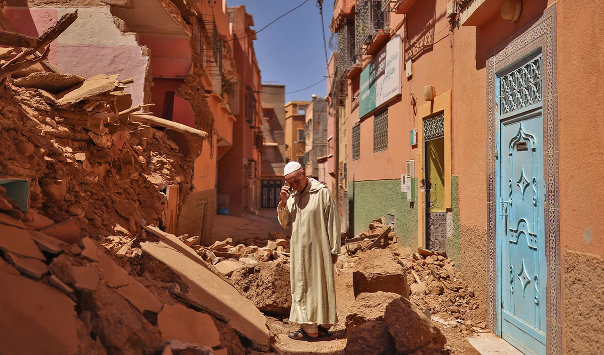 Mohamed Sebbagh, 66, stands in front of his destroyed house, in the aftermath of a deadly earthquake, in Amizmiz, Morocco, on September 10, 2023. (Photo courtesy: REUTERS)