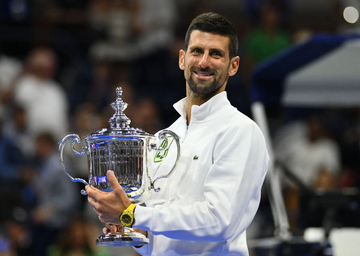 Serbia's Novak Djokovic poses with the trophy after defeating Russia's Daniil Medvedev in the US Open tennis tournament men's singles final match at the USTA Billie Jean King National Tennis Center in New York on September 10, 2023. (AFP)
