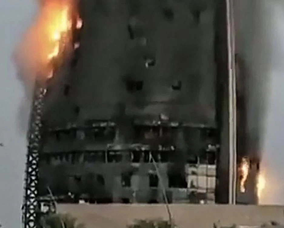 A grab from a UGC video posted on the X platform (formerly Twitter) on September 17, 2023, reportedly shows a raging fire inside the Greater Nile Petroleum Oil Company Tower in Khartoum. (AFP)