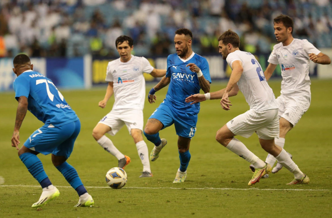Al-Hilal’s Neymar in action with Navbahor Namangan’s Igor Golban at the King Fahd International Stadium in Riyadh. (Reuters)