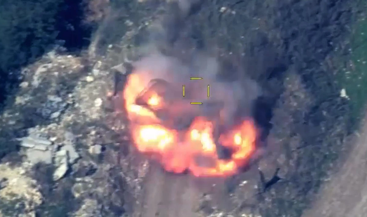 Explosion flame rises over an area which Azerbaijan says hosts Armenian forces' positions in the breakaway territory of Nagorno-Karabakh in Azerbaijan. (AP)