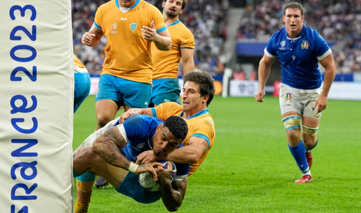 Italy's Monty Ioane scores a try during the Rugby World Cup Pool A match between Italy and Uruguay at the Stade de Nice, in Nice, Wednesday. (AP)