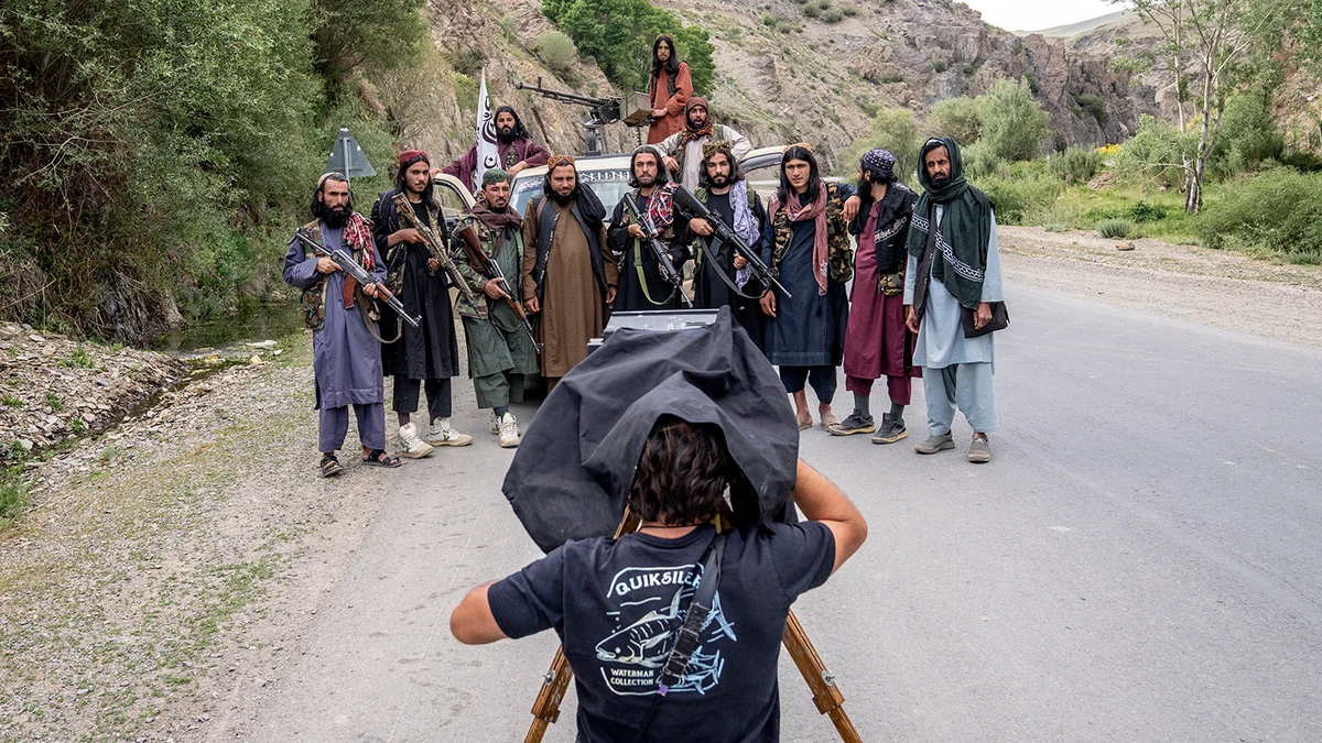 Associated Press photographer Rodrigo Abd takes a portrait of Taliban fighters with a wooden box camera in Bamiyan, Afghanistan, on June 18, 2023. (AP)