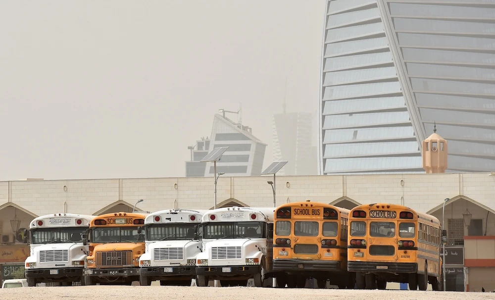 Above, school buses parked in an open area in Riyadh. A recent study noted higher rates of bullying among children in the country’s schools. (AFP)