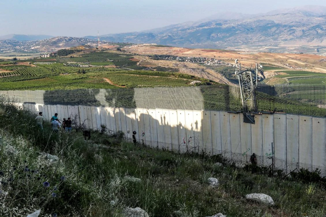 File photo shows the border fence on the outskirts of the southern Lebanese border village of Adaisseh, opposite the border with Israel, on May 25, 2022. (AFP)