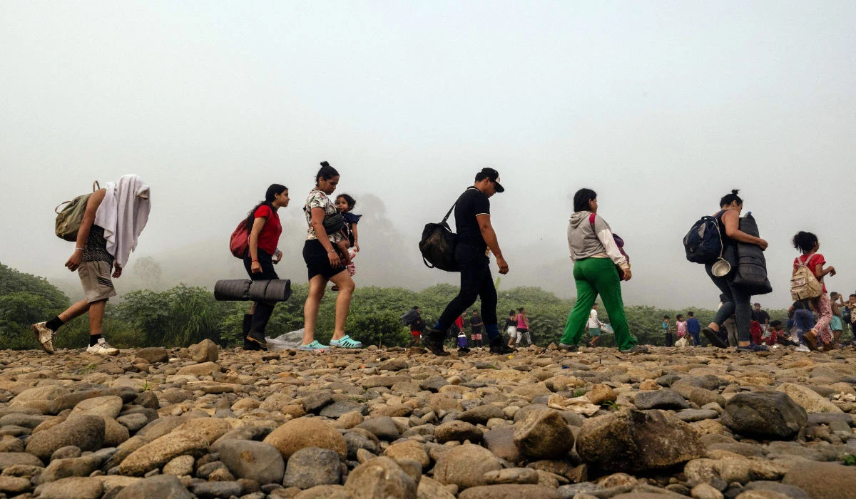 Migrants walk by the jungle near Bajo Chiquito village, the first border control of the Darien Province in Panama, on September 22, 2023. (AFP)