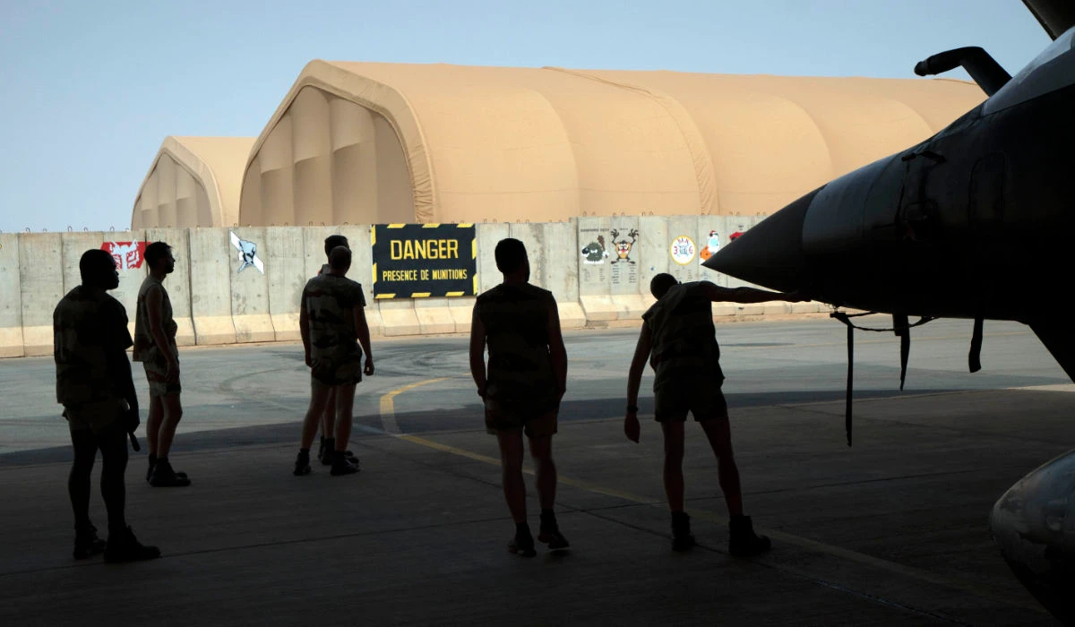 French Barkhane Air Force mechanics maintain a Mirage 2000 on the Niamey, Niger base on June 5, 2021. (AP)