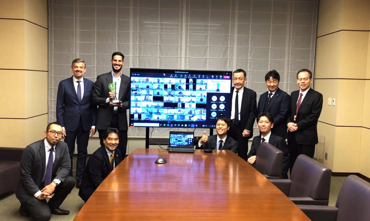 Hassan Jameel, chairman of the board of managers of Abdul Latif Jameel Motors, poses with the Gold Award from Toyota, along with other senior officials.