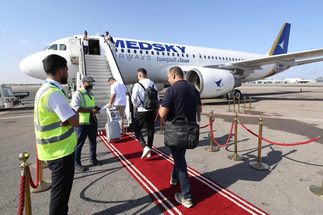 Passengers board the first flight from Tripoli to Rome on Sept. 30, 2023 after the Italian government lifted its 10-year-old air ban on Libyan civil aviation. (AFP)