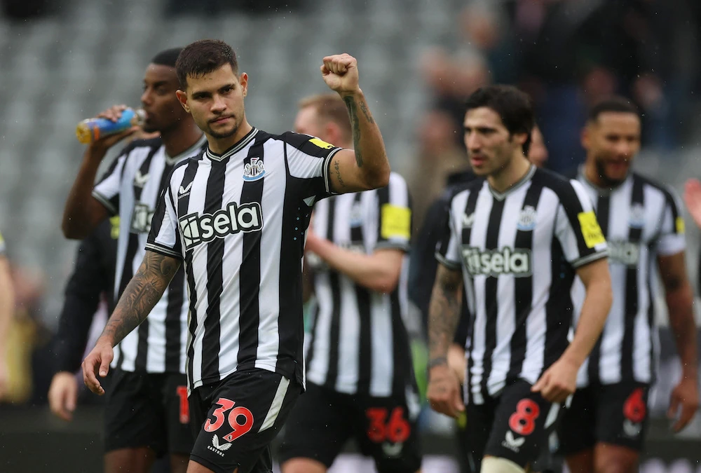 Newcastle United’s Bruno Guimaraes celebrates after the match, in which the Magpies saw off Burnley for another three Premier League points. (Action Images via Reuters)