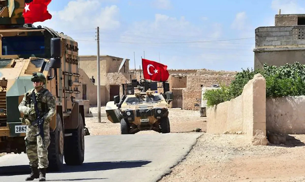 Turkish soldiers accompanied by armoured vehicles patrolling the city of Manbij in northern Syria. (AFP/File)