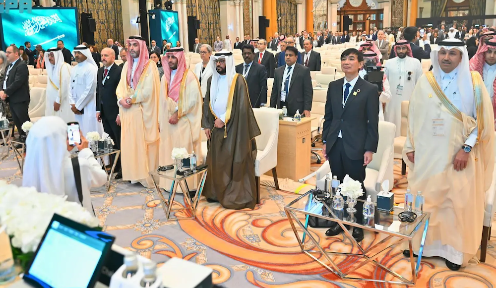 Saleh Al-Jasser, the Saudi minister of transport, right, and Masahiko Metoki, director general of the Universal Postal Union, second right, during the opening of fourth extraordinary conference of the Universal Postal Union on Sunday held in Riyadh. (SPA)