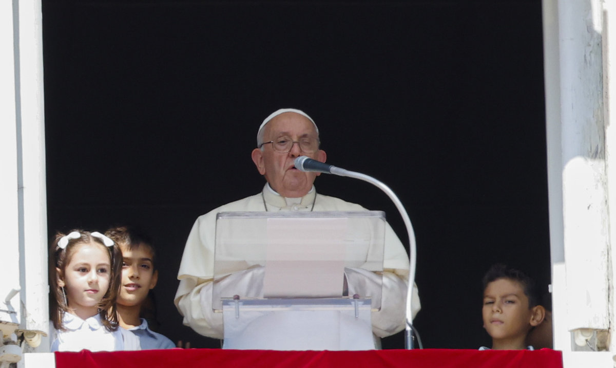 Pope Francis, flanked by children from the five continents, speaks from his studio's window to the faithful gathered for the traditional Sunday's noon blessing in St. Peter's Square at The Vatican, Sunday, Oct. 1, 2023. (AP)