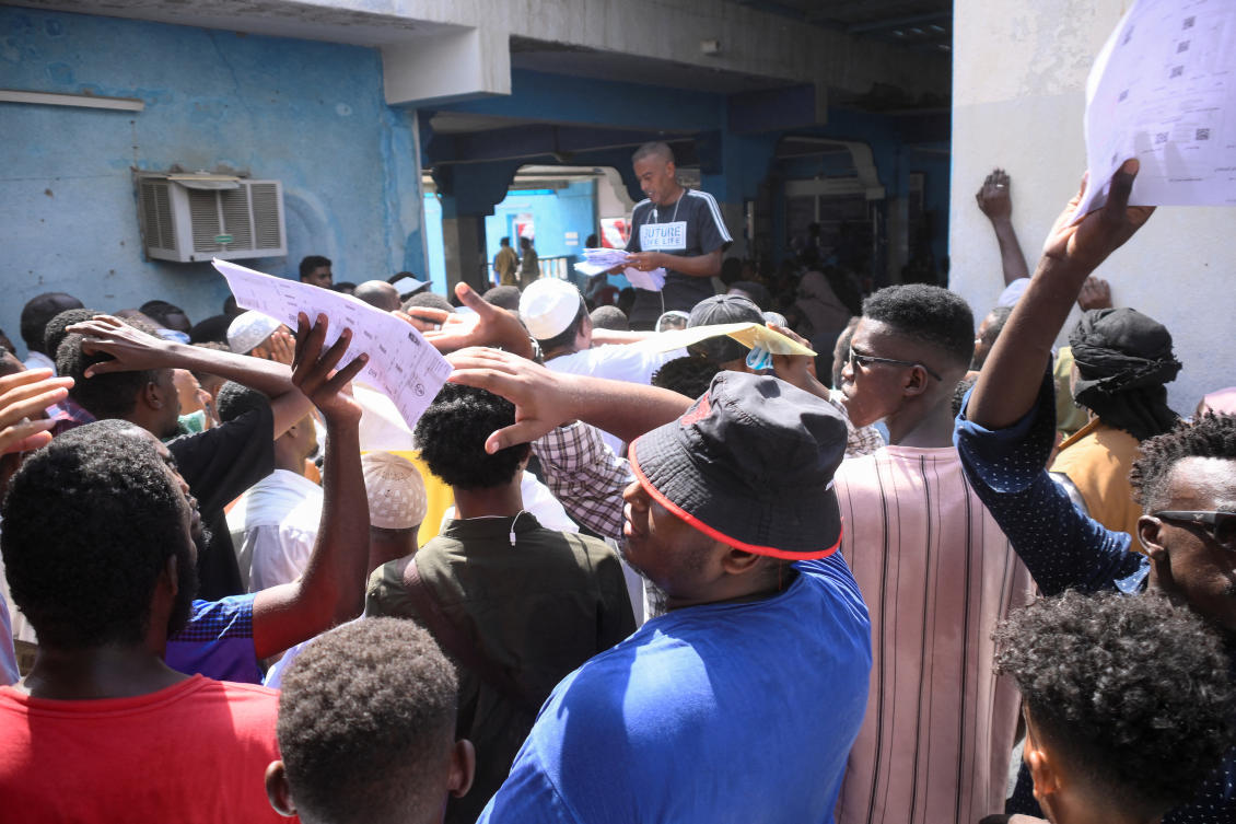 Sudanese citizens gather to renew their passports in the city of Port Sudan, Sudan, September 24, 2023. (Reuters)