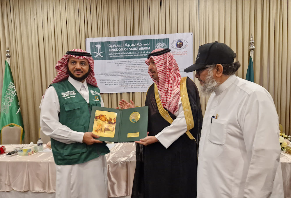 Saudi Ambassador to Bangladesh Essa Al-Duhailan, left, poses for a photo with Dr. Aqeel Al-Ghamdi, KSrelief’s assistant supervisor general for planning and development, middle, during a press conference in Dhaka on Oct. 3, 2023. (AN Photo)