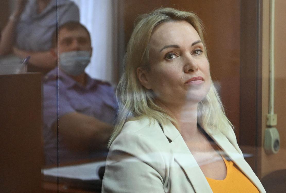 Former state TV journalist Marina Ovsyannikova burst into a news broadcast with a placard that read “Stop the war” and “They’re lying to you.” (AFP)