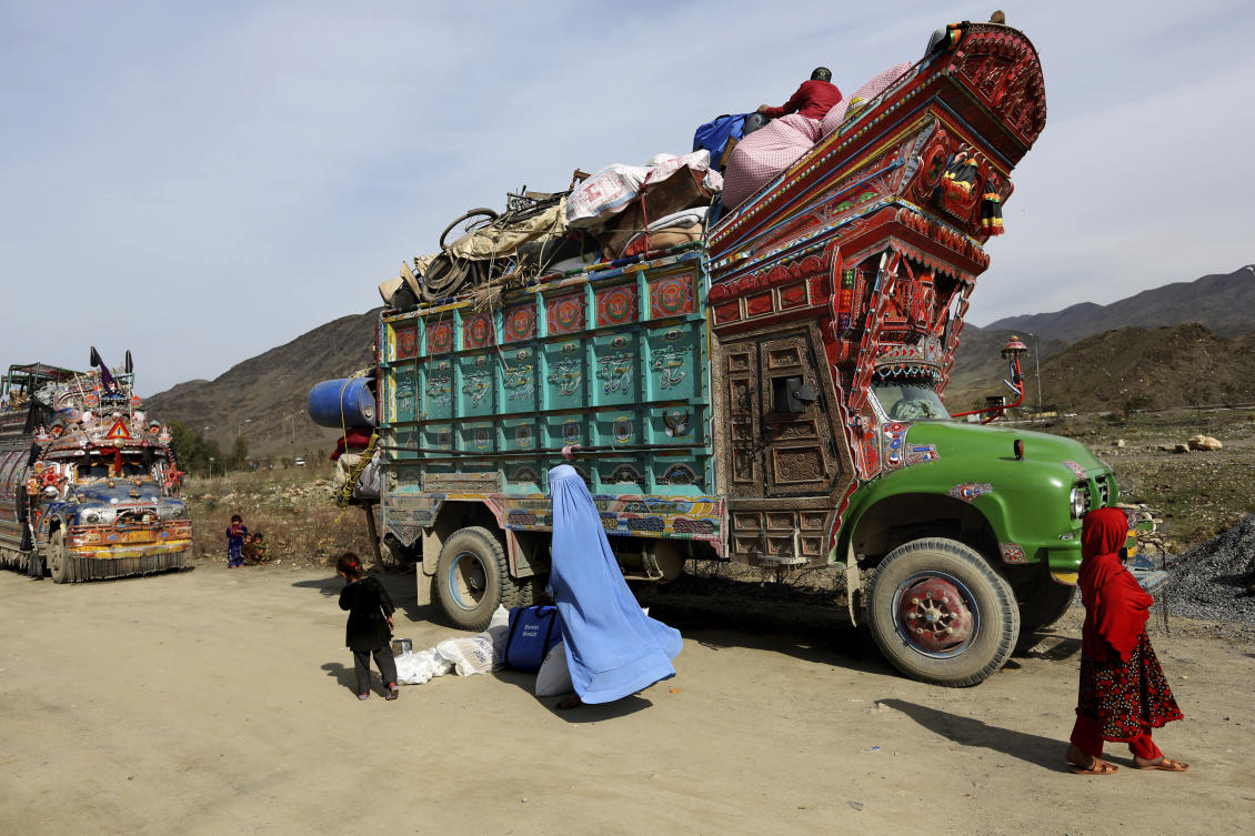 Above, an Afghan refugee family returns to Afghanistan through Pakistan’s border crossing, Torkham. About 1.7 million Afghan refugees live in Pakistan without valid documents. (AP)