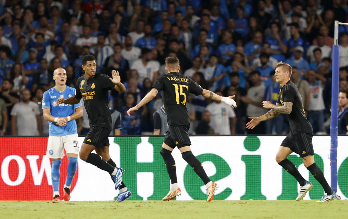 Real Madrid’s Jude Bellingha, Federico Valverde and Toni Kroos celebrate after Vinicius Junior scored their first goal during their Champions League Group C match against Napoli at Stadio Diego Armando Maradona, Naples on Oct. 3, 2023. (Reuters)