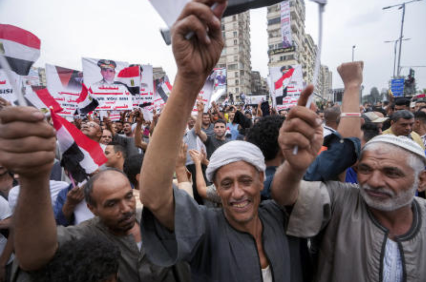 Supporters of Egyptian President Abdel Fattah el-Sisi carry his posters during a march in Cairo, Egypt, on Oct. 2, 2023. (AP)