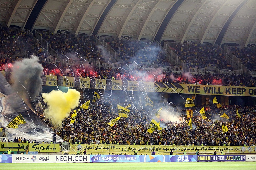 A picture obtained by AFP from the Iranian news agency Tasnim on Monday shows fans reacting to the cancellation of the AFC Champions League Group C football match between Iran’s Sepahan and Saudi Arabia’s Al-Ittihad at the Naghsh-e-Jahan Stadium in Isfahan. (AFP)