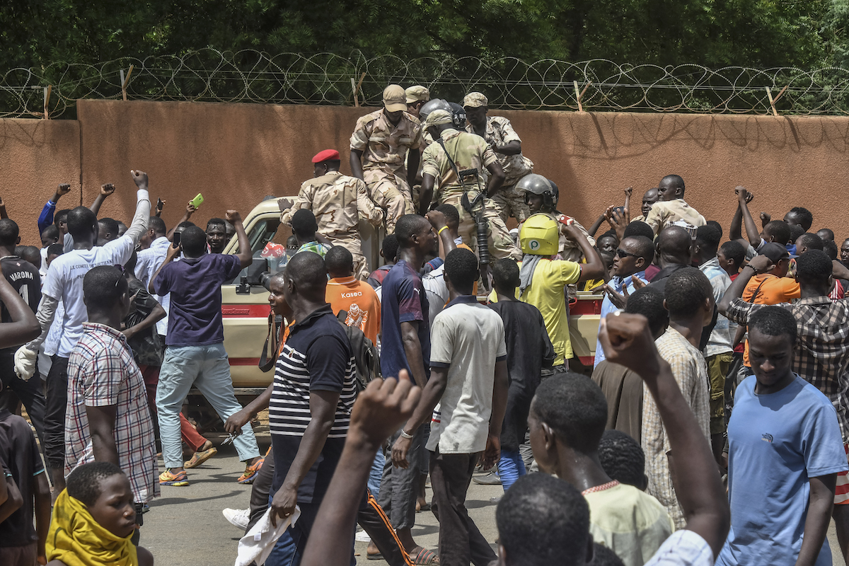 Protesters cheer Nigerien troops as they gather in front of the French Embassy in Niamey during a demonstration that followed a rally in support of Niger's junta in Niamey. (File/AFP)